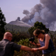Smoke rises from a volcano on the Canary Island of La Palma, Spain on Friday Oct. 1, 2021.